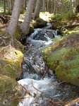 Ogre Creek tumbles through a beautiful valley before plunging over the precipice into the canyon